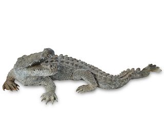 A contemporary outdoor bronze alligator