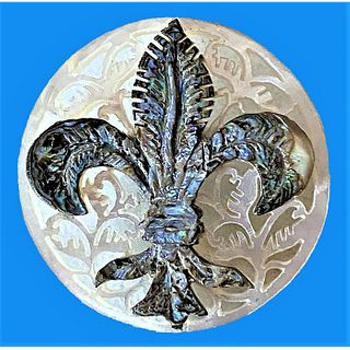 A Division Three Carved And Pierced Bethlehem Pearl Button