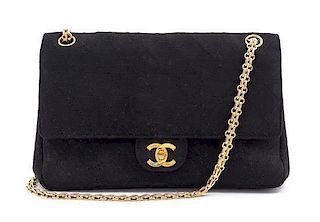 A Chanel Black Fabric Mademoiselle Double Flap Bag, 11" x 7" x 3".