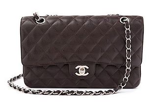 A Chanel Brown Caviar Leather Double Flap Handbag, 10" x 6.5" x 2.5".