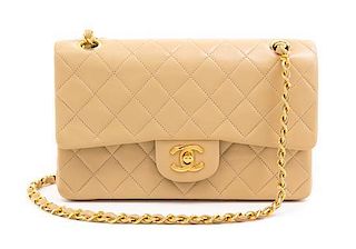 * A Chanel Tan Quilted Leather Double Flap Bag, 9.5"x 5.5" x 2.5".
