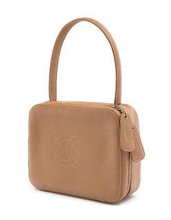 A Chanel Taupe Leather Handbag, 6" x 8" x 2.75".
