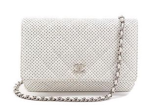 A Chanel White Dot Flap Handbag, 7.5" x 5" x 1".