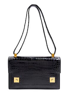 An Hermes Black Crocodile Piano Handbag, 9" x 6" x 2".