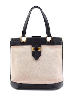 An Hermes Black Leather and Canvas Handbag, 10" x 12" x 3".