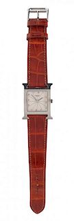 An Hermes Stainless Steel Heure H Wristwatch, Size PM, 9" x 1".