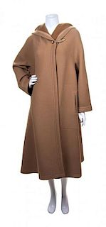 * An Hermes Tan Wool Hooded Coat, Size 42.