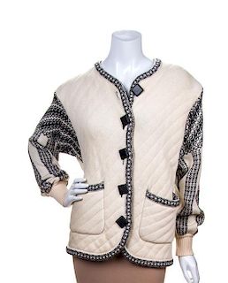 * An Yves Saint Laurent Cream Wool Knit Jacket, Size 36.
