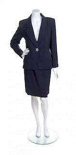 An Yves Saint Laurent Navy Wool Ribbed Skirt Suit, Size 38.