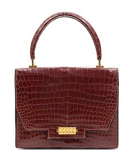 An Hermes Brown Crocodile Handbag, 9.5" x 7.5" x 1.5".