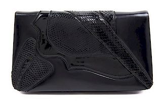 A Judith Leiber Black Leather Clutch, 8.5" x 5" x 1".