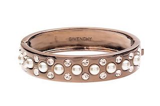 A Givenchy Copper Tone Hinge Bracelet, 2" interior diameter.
