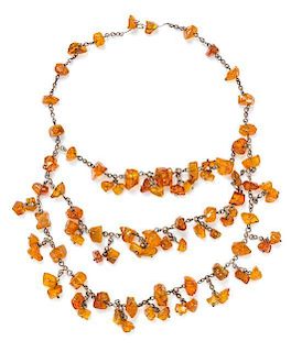 A Triple Strand Amber Necklace, 15".