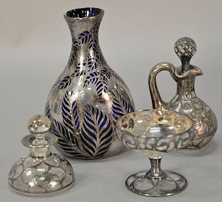 Four silver overlay glass pieces to include blue glass vase with leaf design stemmed glass, perfume, and a small bottle. ht. 2 3/4" ...