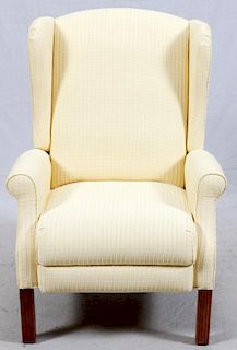 YELLOW UPHOLSTERED AND MAHOGANY WING BACK ARM CHAIR