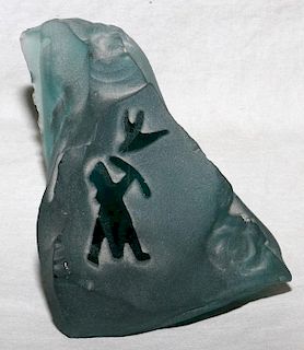 CARVED GLASS OF AN ESKIMO HUNTING A BIRD