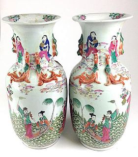 Pair of Chinese ca. 1800 porcelain vases with molded lizards, enameled scenes of musicians dancing and standing on animals 18" ht. Overall good condit