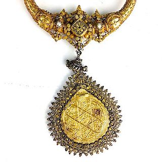 Indo Persian yellow gold necklace and pendant (tests 18k) 2 .25" diameter gold disc pendant w/Arabic decoration & bead w/seed pearl surround, chain ha