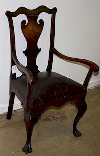 18th c Pennsylvania Chippendale walnut armchair, trifid feet, shaped crest and skirt. 38"h.