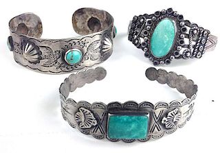 Three Southwest silver & hardstone bangle bracelets; one with peace symbols, birds &  diamond and round shaped turquoise stones, other marked silver p