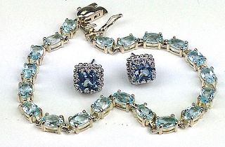 Aquamarine bracelet having 21 oval cut  6mm x 4mm stones 7" L. set in sterling,  with pair of square cut aquamarine earrings 7mm x 7mm set in sterling