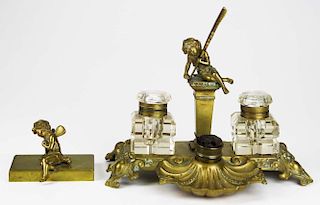 French brass figural writing stand, sold with a matching figural paperweight, length 10ﾔ, ht 8ﾔ