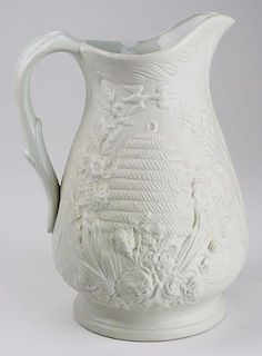 19th c. Parian pottery pitcher with embossed beehive and kissing doves 10" x 7"