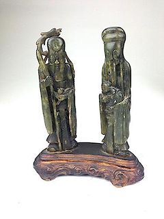 Chinese nephrite jade  carved pair of male figures, one holding child, mounted to gilt bronze bas. Figures  6.5"ht.. 7.5" total height-repair to figur