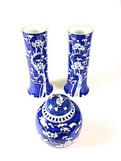 pair of ca. 1900 Chinese blue and white vases, and ginger jar, having dark blue background and blossom tree decoration 10.5", 6.5"