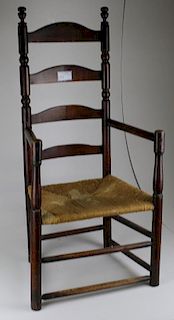 Early New England maple turned ladder-back arm chair. Appears original.
