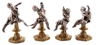 Set of Four Silver Putti and Dolphin