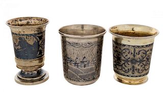 A GROUP OF THREE ANTIQUE RUSSIAN SILVER AND NIELLO CUPS, MOSCOW, 1830S-1850S