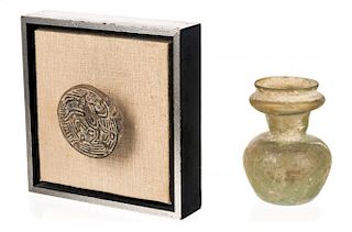 A PAIR OF ANTIQUITIES INCLUDING A GLASS JAR AND AN AZTEC MEDALLION