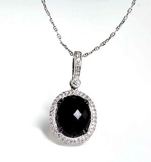 14K White Gold Pendant, with an oval faceted 7.93
