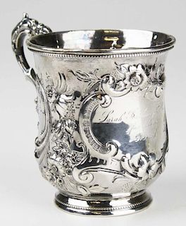 Hand chased sterling silver presentation mug with elaborate floral and scroll pattern. Inscribed "Sarah Southmayd Allen from her aunt S.A.S." Unmarked