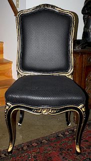 Set of 12 ornate French gilt and black paint, upholstered dining chairs, minor gesso flaking. 20th c