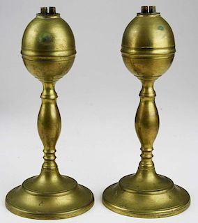pr of mid 19th c brass whale oil lamps, seamed with round peened shafts onto bases, ht 8”