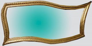 Ornate gilt wave over mantle mirror circa 1990. 84'w x 40"h.
