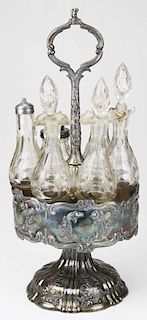 ornate Victorian silver plated caster set with fine cut glass cruets 16" x 7"