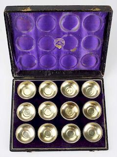 Cased set of Tiffany & Co sterling silver salt cellars. Monogrammed JCC. Tiffany & Co 778 Sterling. _"h x 1_"w. 7.4 troy oz.