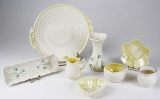 7 pcs Beleek Irish bone china table ware incl. vase, pen tray, thistle dish, heart dish, leaf form dish, handled shell servin