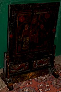 19th c elm and softwood screen on shoe foot stand lacquer and gilt with genre paint scene. 31"h x 22"w.