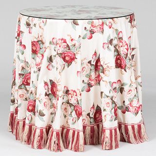 Two Contemporary Circular Tables Draped with Red and Rose Printed Chintz Fabric