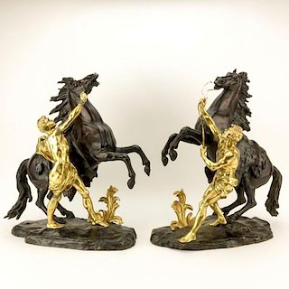 after: Guillaume Coustou the Younger, French (1716-1777) Pair of Patinated and Gilt Bronze Marly Horses.