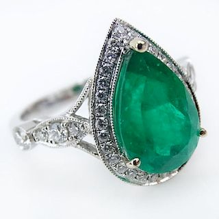 AIG Certified 3.94 Carat Mixed Cut Emerald, .53 Carat Round Brilliant Cut Diamond and 18 Karat White Gold Ring.