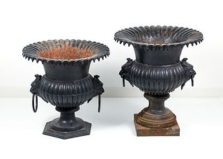 Two Victorian cast iron garden urns with side handles