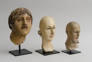 GROUP OF FOUR MISCELLANEOUS PAINTED WOOD AND PAPIER MÂCHÉ BUSTS