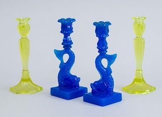 PAIR OF SANDWICH-TYPE MOLDED BLUE GLASS DOLPHIN-FORM CANDLESTICKS AND A PAIR OF VASELINE GLASS STICKS