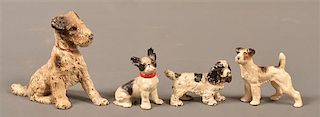 Four Hubley Cast Painted Cast Iron Dog Form Bookend and Paperweights.