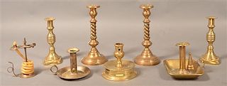 Grouping of Eight Antique Brass Candlesticks.